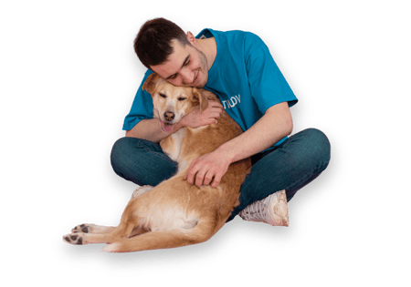 Man hugging elderly dog