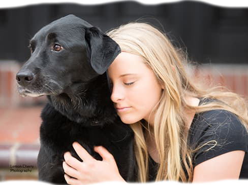 Woman hugging dog